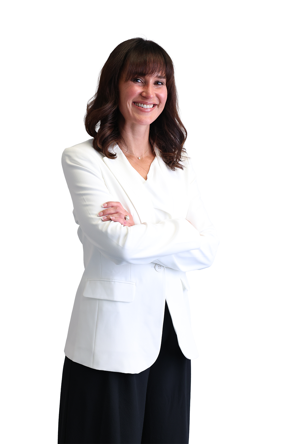 Smiling woman with long brown hair in a white blazer crosses her arms confidently against a black background. Professional and approachable tone.
