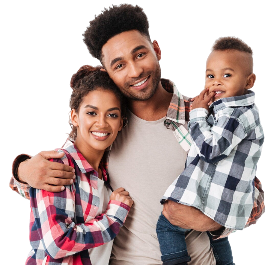 A smiling family of three, wearing plaid shirts, stands against a black background. The father holds the child, while the mother is beside them, exuding warmth.