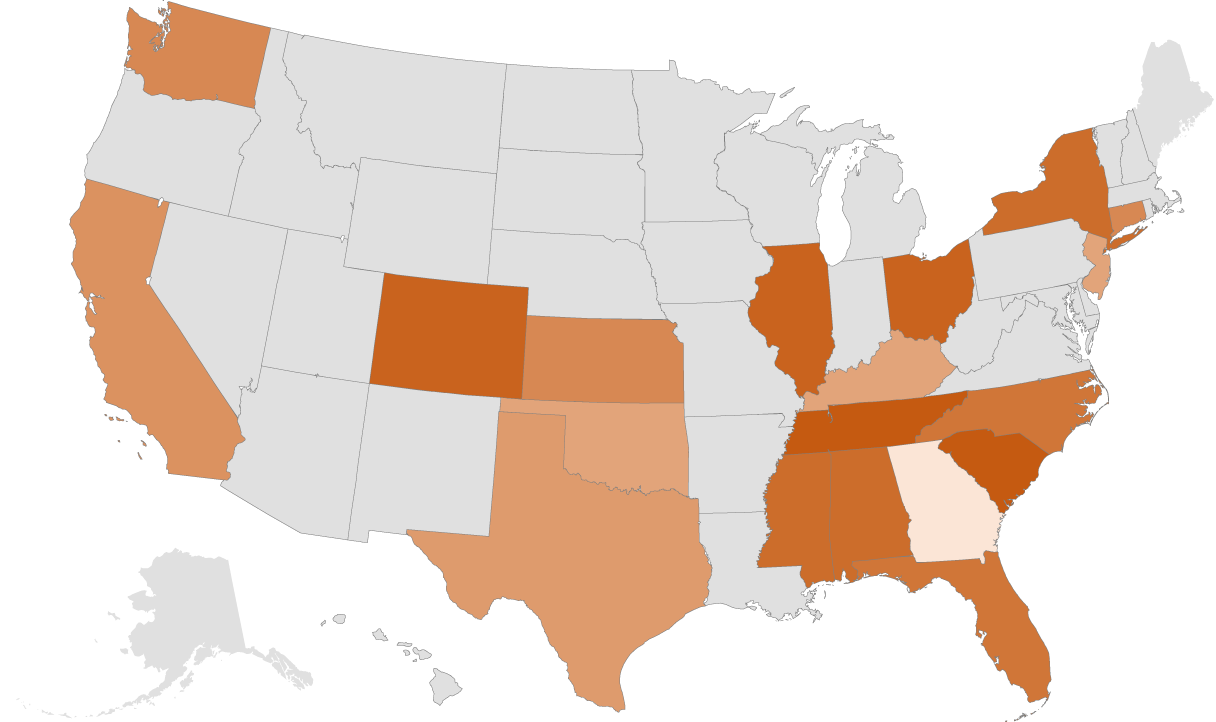 Map of the United States with certain states highlighted in orange, indicating a specific category or data set against a black background.