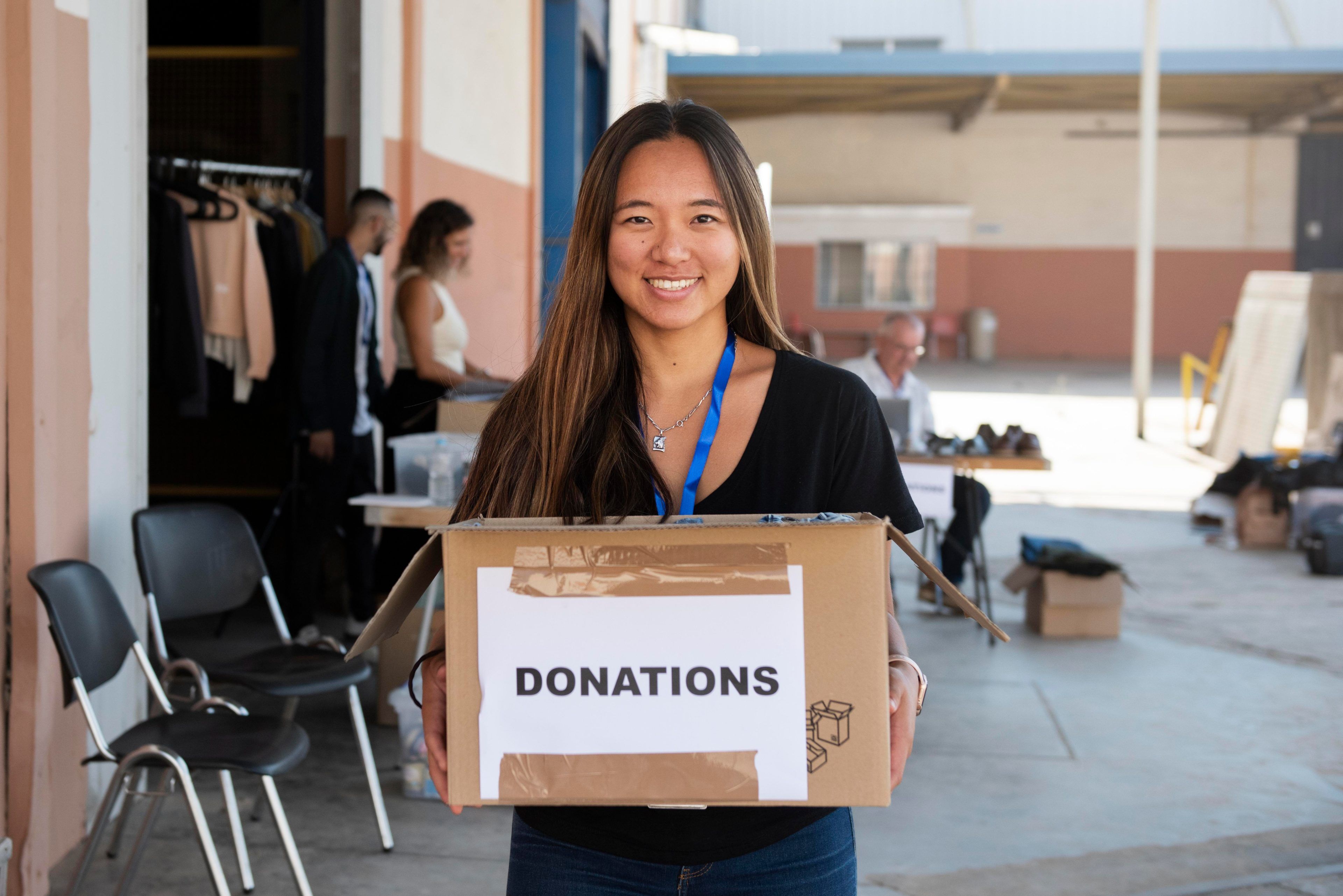 Volunteer holding donations