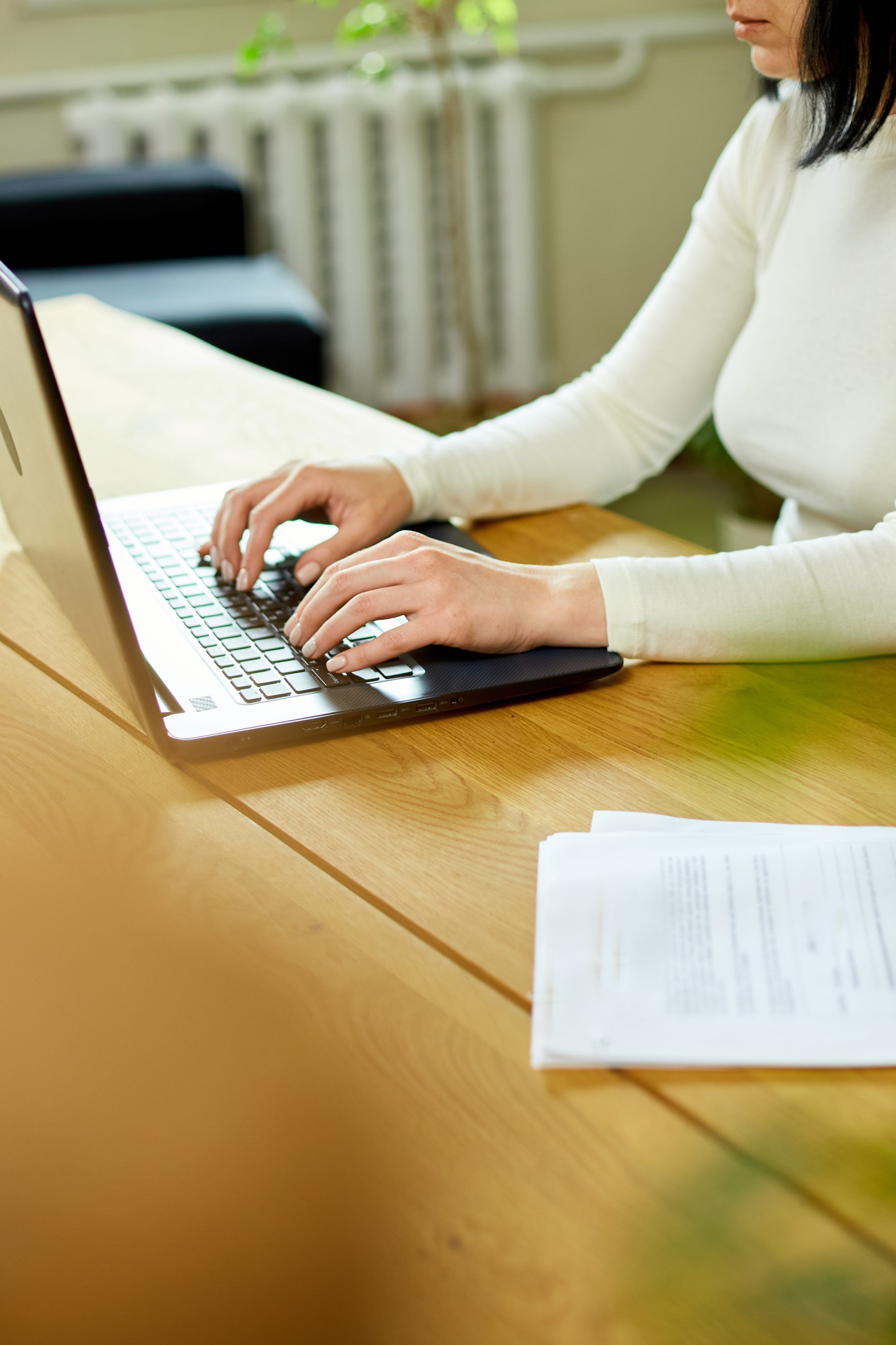 Close up of female hands working on computer